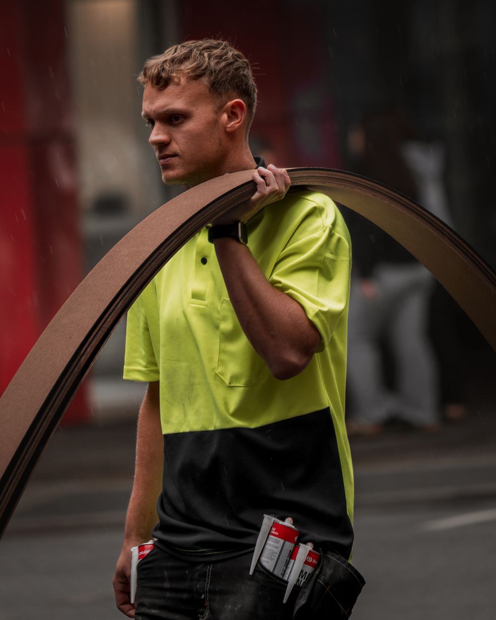 Young tradesperson in a two-tone hi-vis shirt